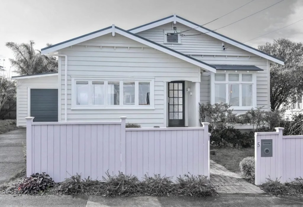 Restored front facade and classic veranda of a heritage villa in Onehunga, updated by a specialist villa renovation designer in a colour pop